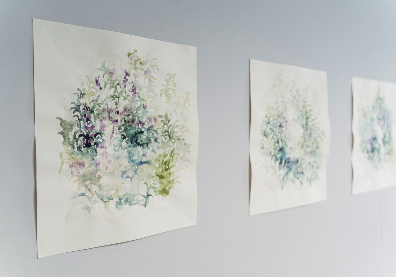 Soft watercolour wall art on a neutral wall, chosen for calm room tone