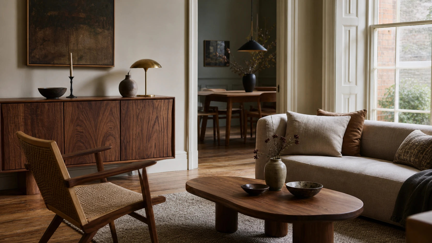 A coordinated walnut furniture scheme in a British townhouse living and dining space