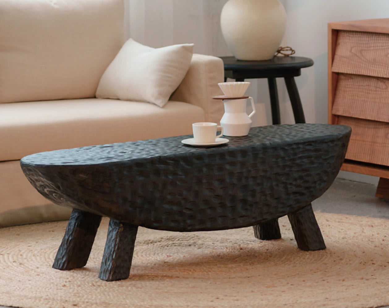 Dark hand-textured sculptural coffee table